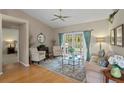 Inviting living room with hardwood floors, French doors to the lanai, and a neutral color palette at 4311 W Beach Park Dr, Tampa, FL 33609