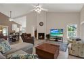 Bright and open living room with high ceilings, fireplace, and comfortable seating at 4694 Huron Rd, St Petersburg, FL 33708