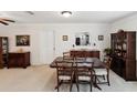 Elegant dining room with traditional furnishings, neutral carpet, and ample seating at 5812 52Nd N Ave, Kenneth City, FL 33709