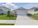 Beautiful one-story home with a well-maintained lawn and a spacious driveway at 6281 Dry Tortugas Dr, Sarasota, FL 34241