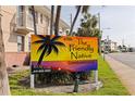The Friendly Native Condominiums sign showing complex name and contact information at 6700 Sunset Way # 303, St Pete Beach, FL 33706