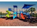 Fun, colorful community playground with slides, climbing structures, and a soft rubber surface for safety at 6807 162Nd Pl, Parrish, FL 34219