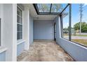 Spacious covered front porch offering ample space for seating and outdoor decor at 9107 Spring Hill Dr, Spring Hill, FL 34608