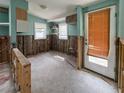 Partially renovated living area with exposed framing, offering a glimpse of the potential for a dream living space at 13326 1St E St, Madeira Beach, FL 33708