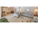Spacious and inviting living room featuring neutral decor, plush seating, and ample natural light at 13821 Joyce Dr, Largo, FL 33774
