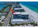 An overhead shot of a condo building near the beach featuring a parking lot at 1400 Gulf Blvd # 804, Clearwater Beach, FL 33767