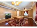 Inviting game room features a pool table, fish tank, and seamless flooring transitions at 18424 Cypress Bay Pkwy, Land O Lakes, FL 34638