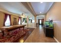 Spacious game room featuring a classic pool table and ample natural light at 18424 Cypress Bay Pkwy, Land O Lakes, FL 34638