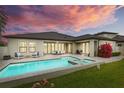 Backyard view of private pool and patio area, perfect for outdoor entertaining at 21642 Emory Oak Pl, Land O Lakes, FL 34637