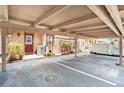 Assigned carport parking with well maintained landscapes, front door, and outdoor lighting at 3203 Doe Ct, Brandon, FL 33511