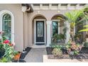 Charming entryway with manicured landscaping and an elegant front door at 32242 Summerglade Dr, Wesley Chapel, FL 33545