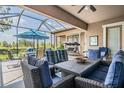 Enjoy the large screened-in patio with ample seating and outdoor views at 32242 Summerglade Dr, Wesley Chapel, FL 33545