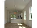 Bright living room area with wood floors, neutral paint, and lots of natural light at 36755 Thomas Jefferson Rd, Dade City, FL 33525