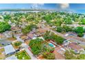 Aerial view of property with pool outlined with a red rectangle, surrounded by lush landscaping and neighborhood at 4228 Tarpon Se Dr, St Petersburg, FL 33705