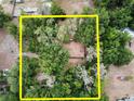 Aerial view of the property highlighting its lush tree coverage and secluded location at 4720 Coats Rd, Zephyrhills, FL 33541