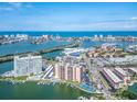 Stunning aerial view of a waterfront condo community offering amazing ocean views and boat access at 51 Island Way # 503, Clearwater Beach, FL 33767