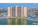 Waterfront condo building with marina, pool, tennis court, boat docks and balconies offering beautiful views at 51 Island Way # 503, Clearwater Beach, FL 33767