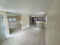 Spacious living room with tiled floors and a combined kitchenette area at 8503 N Willow Ave, Tampa, FL 33604