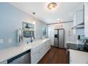 Bright kitchen with white cabinets, stainless steel appliances, and modern countertops at 9043 108Th Ave, Seminole, FL 33777