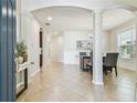 Spacious foyer with tile flooring, arched entryways, and an elegant dining area at 9317 Bella Vita Cir, Land O Lakes, FL 34637
