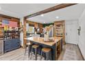 Open kitchen features butcher block island with seating and stainless steel appliances at 9821 113Th St # 201, Seminole, FL 33772