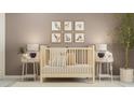 A furnished Bedroom exhibits a crib, framed animal artwork and neutral colors, creating a serene atmosphere at 10225 Trumpet Honeysuckle Way, San Antonio, FL 33576