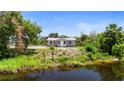 Freshly renovated single-story home nestled in a lush, private setting with waterfront views at 11009 Spivey Rd # 1, Gibsonton, FL 33534