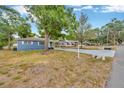 Single-Gathering home with a long driveway, mature trees, and a mailbox at 1304 N Ferrell St, Plant City, FL 33563