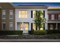 Charming two-story home with white siding, black shutters, and a well-manicured front yard at 14648 Bournemouth Rd, Tampa, FL 33626