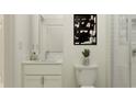 Bathroom showcasing a walk-in shower with glass door, a marble countertop, and neutral wall paint at 18473 Serene Lake Loop, Lutz, FL 33548