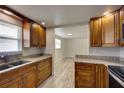 Beautiful kitchen featuring granite countertops and wooden cabinets with appliances and natural light at 2608 Browning St, Sarasota, FL 34237