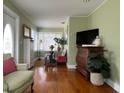 Cozy living room features hardwood floors, a large window, and stylish decor at 3031 56Th S St, Gulfport, FL 33707