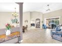 Open-concept living room with neutral tones and lots of natural light at 311 Parsons Woods Dr, Seffner, FL 33584