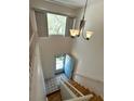 Bright entryway featuring stairs, tile floor and high ceilings, with lots of natural light coming in at 3276 38Th S Way # D, St Petersburg, FL 33711