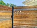 Close-up view of the wooden privacy fence displaying the house number at 5111 28Th N Ave, St Petersburg, FL 33710