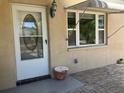 A nicely decorated front entrance door and window at 7425 W Maryland W Ave, Hudson, FL 34667