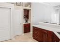 Modern kitchen area featuring custom dark wood cabinets and quartz countertops at 7533 Dunbridge Dr, Odessa, FL 33556