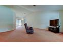 Spacious living room with large windows and plush carpeting perfect for relaxing at 11325 Glenmont Dr, Tampa, FL 33635