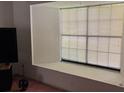 Bright room with large window and sitting ledge, offering a relaxing space with ample natural light at 11325 Glenmont Dr, Tampa, FL 33635