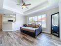 Sunlit living room showcasing hardwood floors and a stylish daybed at 18001 Richmond Place Dr # 330, Tampa, FL 33647