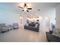 Spacious living room with tile flooring and neutral colors, perfect for entertaining at 18933 Sailors Delight Pass, Land O Lakes, FL 34638