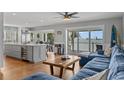 Open floor plan with bar area and water views at 297 1St W St, Tierra Verde, FL 33715