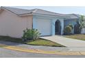 A single story home with a one car garage and small courtyard at 5404 Springwood Blvd # 5404, Pinellas Park, FL 33782