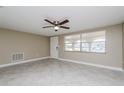 Open living area with natural light and tiled floors at 7405 Oakshire Dr, Port Richey, FL 34668