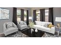 Comfortable living area featuring neutral tones, stylish seating, and ample natural light at 7529 35Th N Ave, St Petersburg, FL 33710
