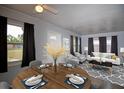 Well-lit living area with an adjacent dining space, and contemporary furnishings at 7529 35Th N Ave, St Petersburg, FL 33710