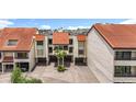 Charming condo building with covered parking, manicured landscaping and well maintained facade at 120 1St E St # 104, St Petersburg, FL 33715