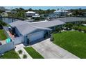 Charming home with an attached garage, well-maintained landscaping, and a spacious driveway, showcasing suburban living at 1769 Brookside Blvd, Largo, FL 33770