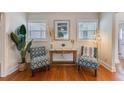 Comfortable sitting area featuring stylish chairs, an attractive table, and bright natural lighting at 2180 7Th Ave N, St Petersburg, FL 33713