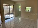 The dining area has tile floors and sliding doors to a private patio at 2720 Sand Hollow Ct # 156A, Clearwater, FL 33761